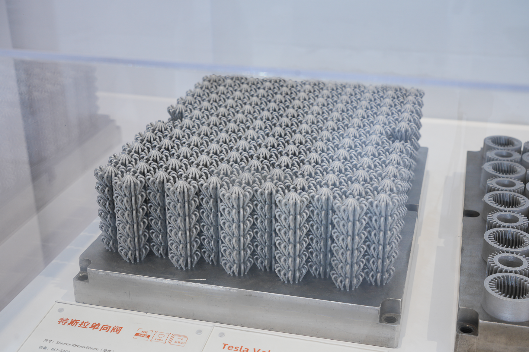 Tall metal additive Tesla-valve blanks nested on a build plate