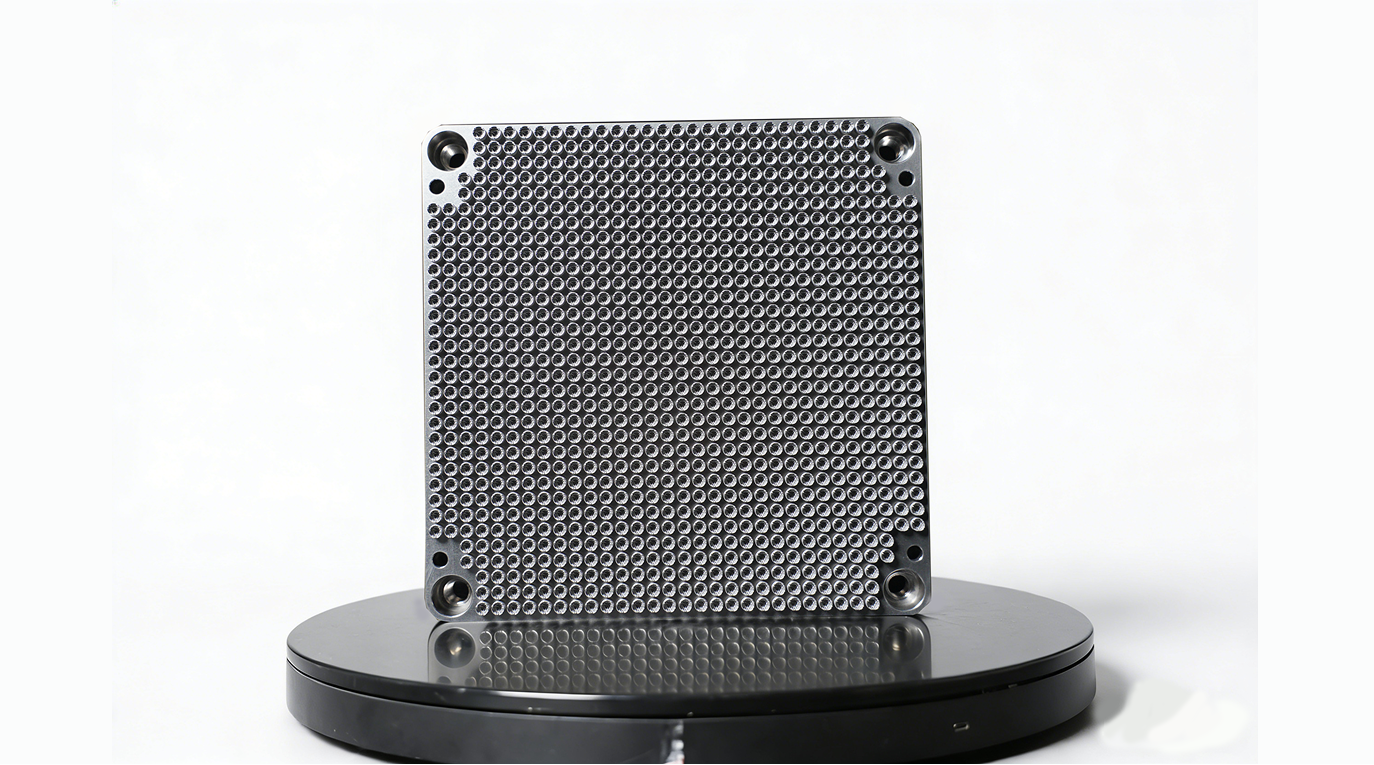 Square metal additive micro-feature coupon plate on a black display stand