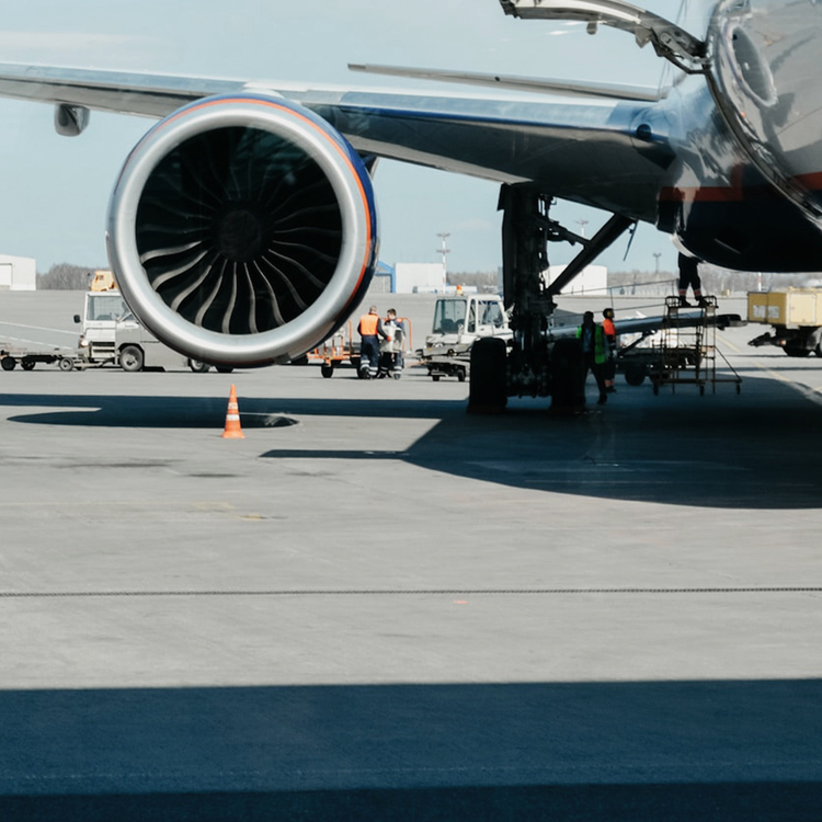 Commercial turbofan engine on the tarmac during ground service