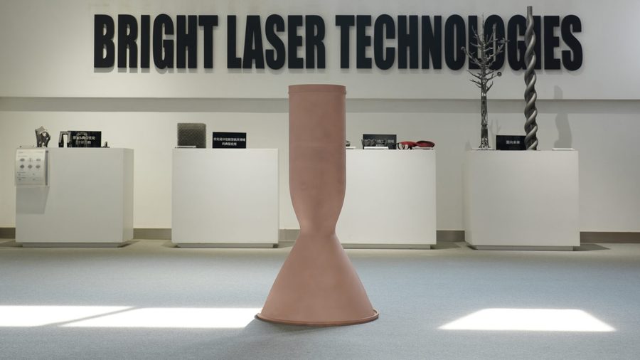 Copper additive rocket thrust-chamber liner blank in a showroom aisle
